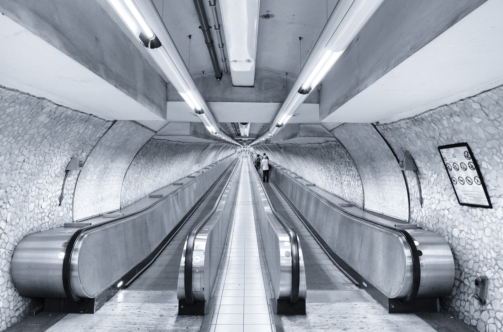 gray concrete tunnel with white light